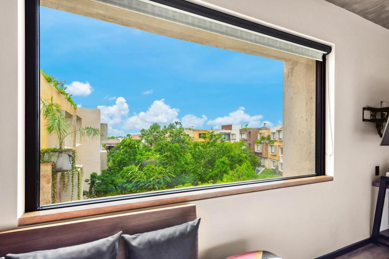 Quarto Duplo com 2 Camas de Casal e Vista da Selva