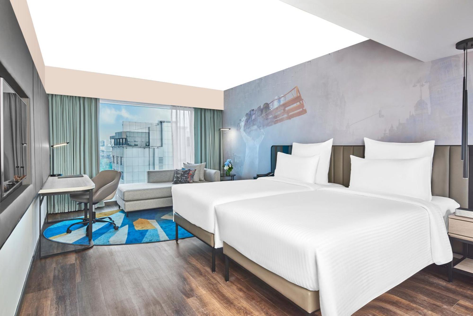 Deluxe Room Twin Beds with 1+1 Happy Hours from 5pm to 7 pm on select beverages , 20% Discount on Spa on select packages, Laundry, and Food & Soft Beverages