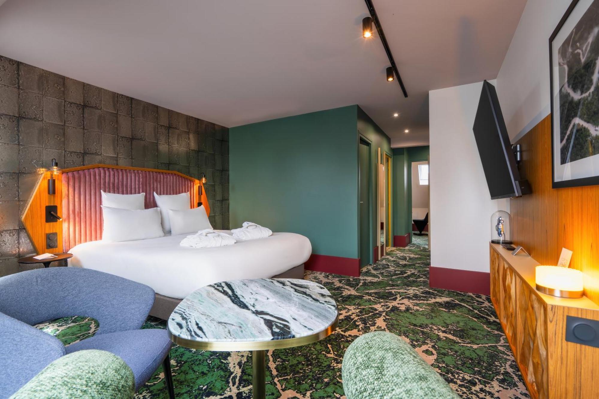 Deluxe Suite met 1 queensize bed en bank