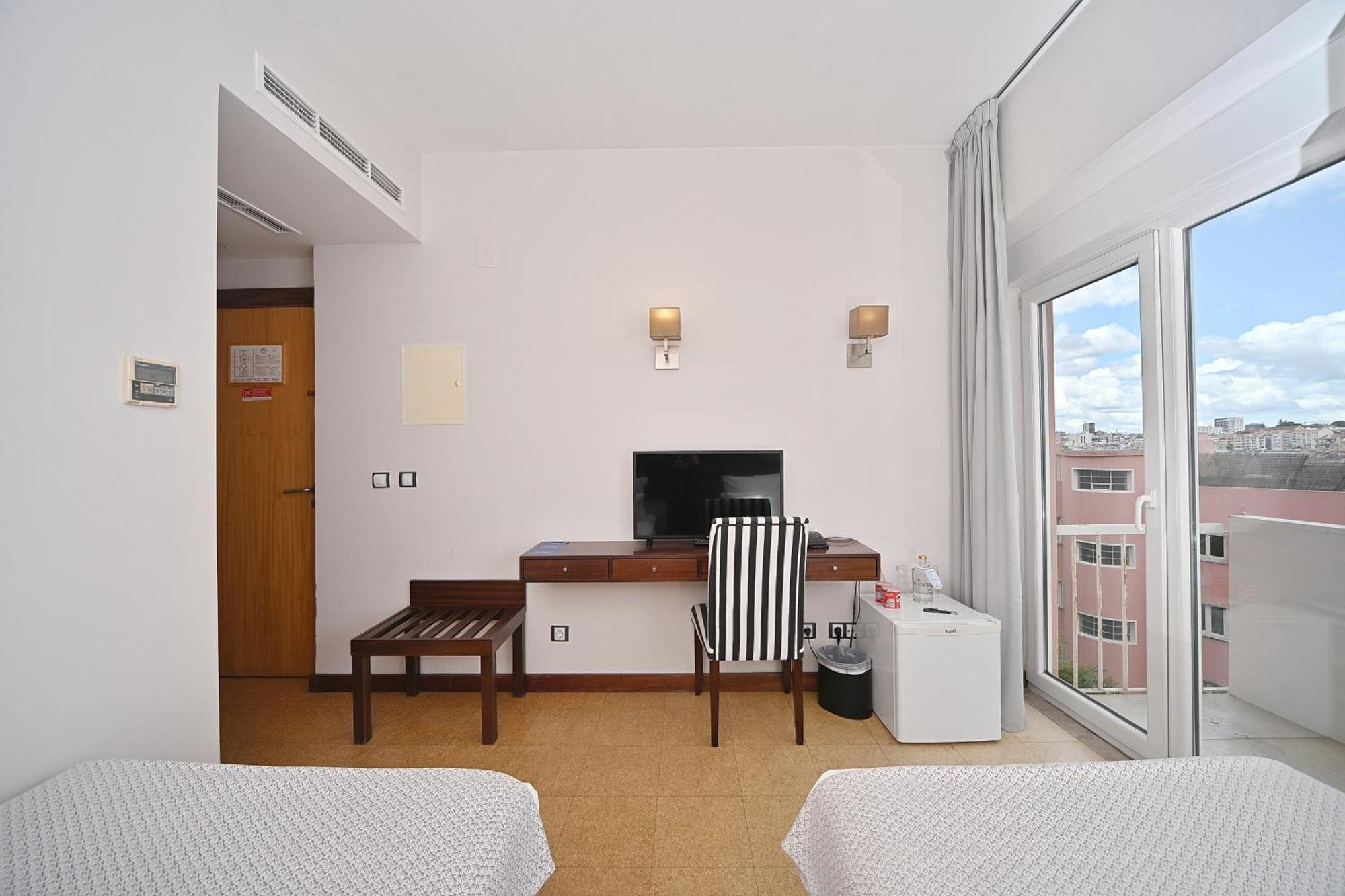 Quarto Deluxe com Cama de Casal ou 2 de Solteiro