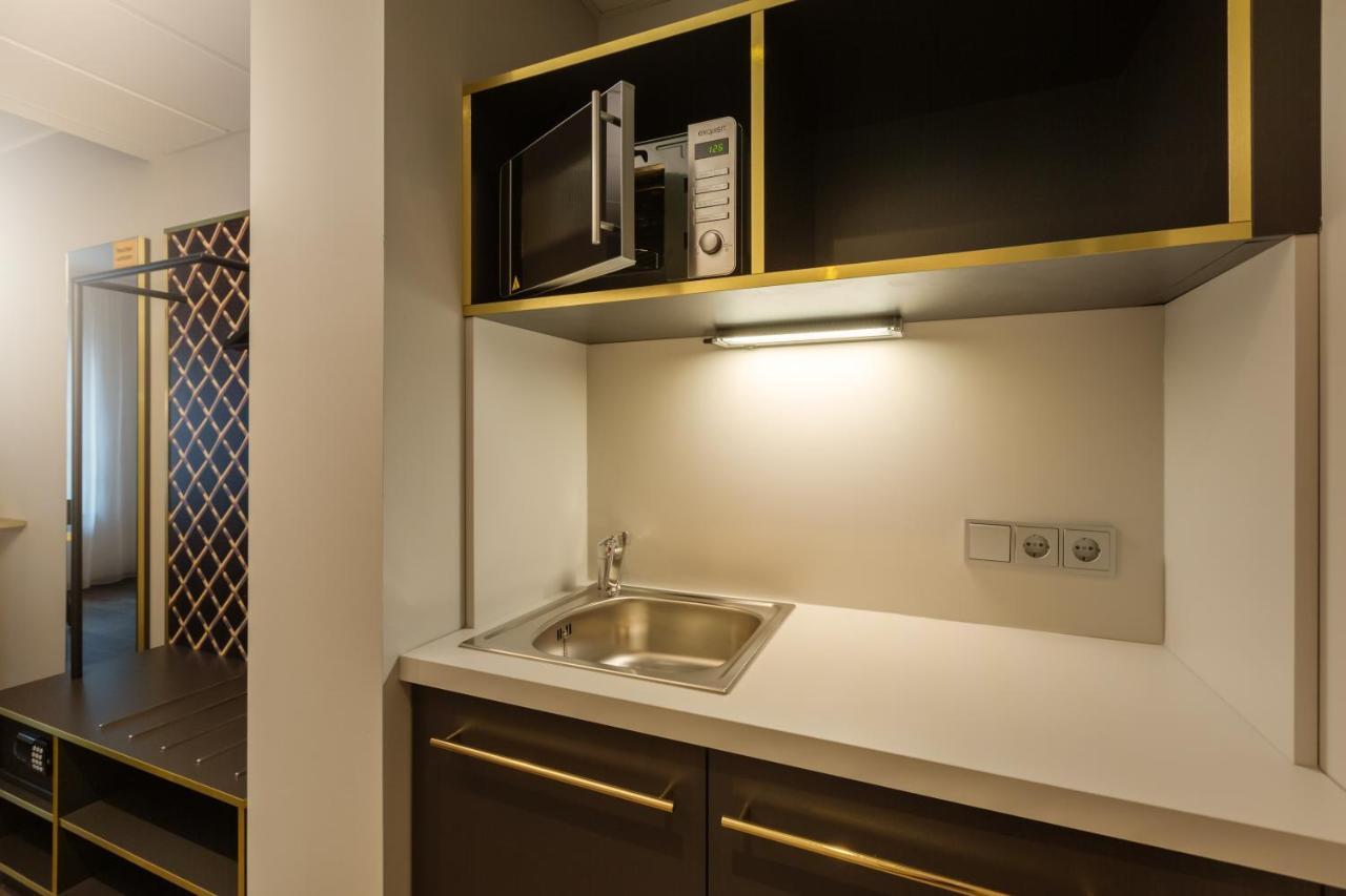 Premium Zimmer mit Queensize-Bett und Küchenzeile